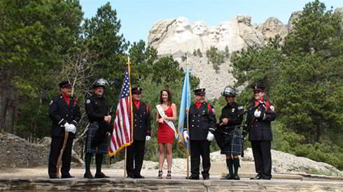 Anna Simpson Miss South Dakota 2011 with Police and Firefighters